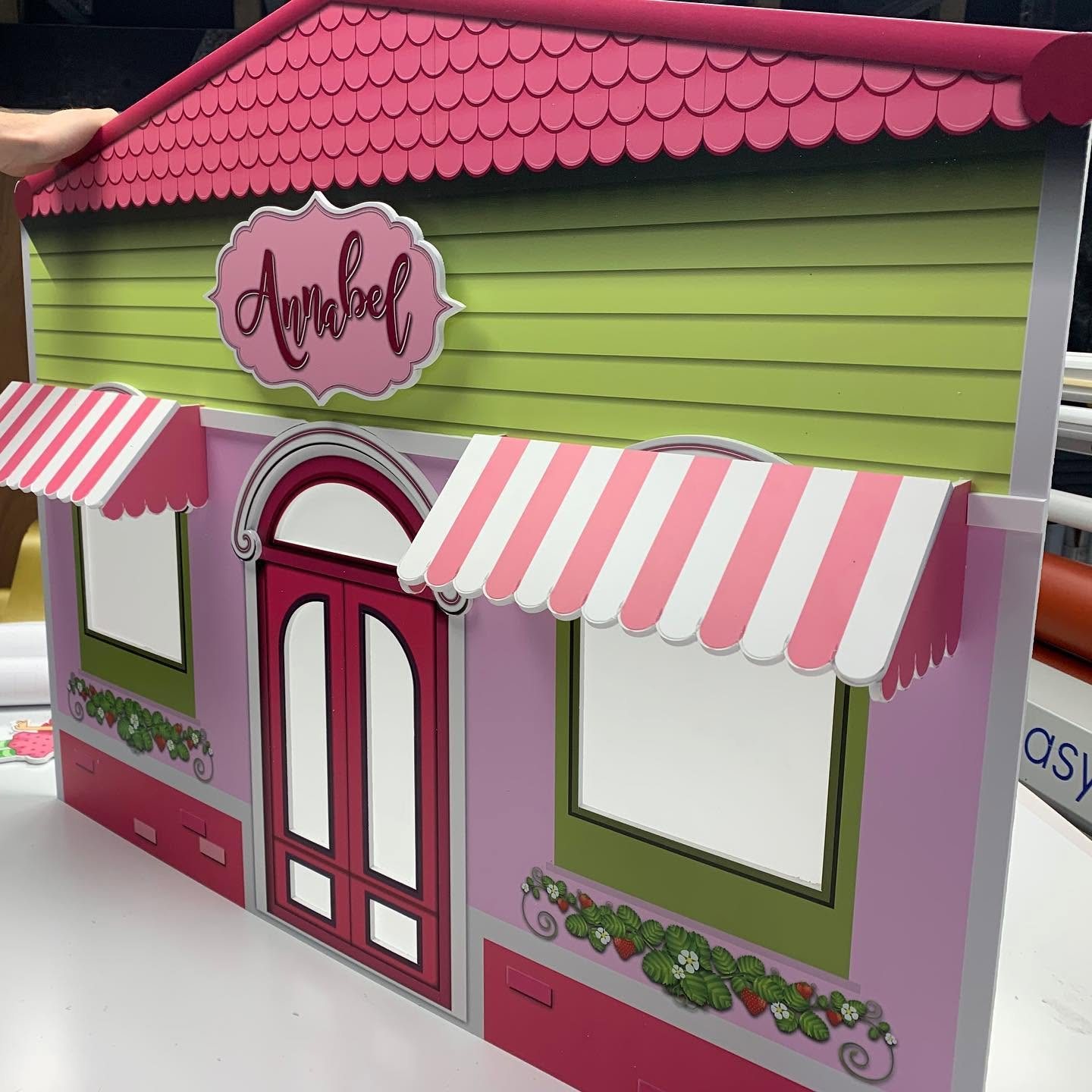 Layered awnings, roof tiles and name plaque, Zund cut for real depth