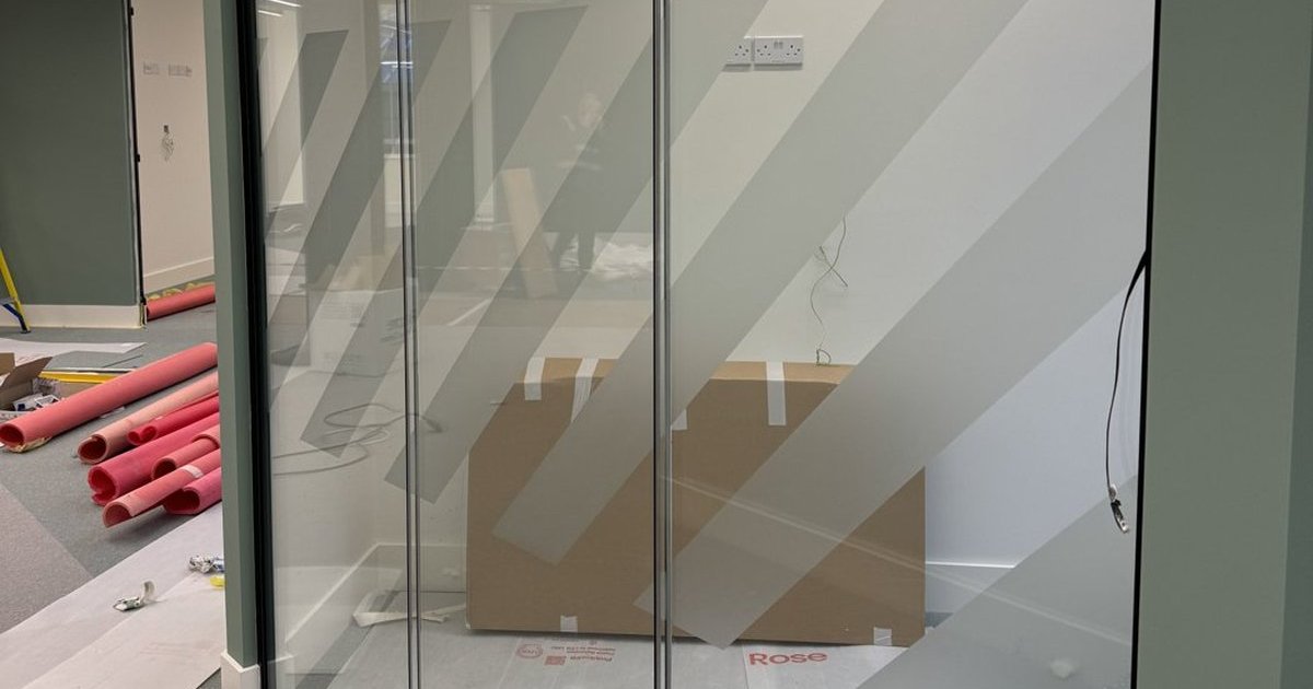 Frosted privacy bands on a glass office partition