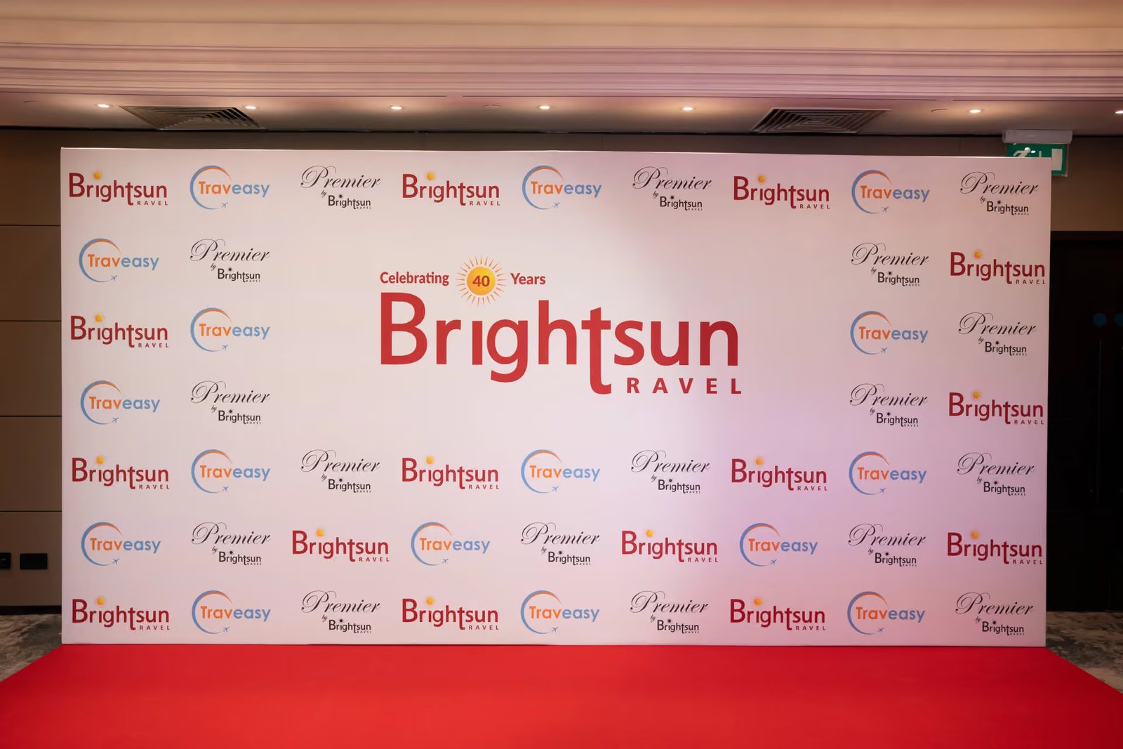 The white Brightsun partner media wall above the red carpet
