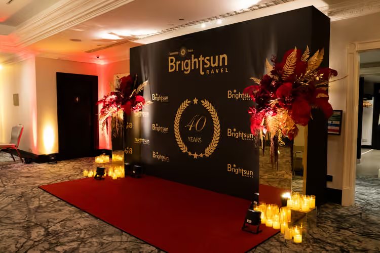 The black and gold 40 Years wall from across the foyer