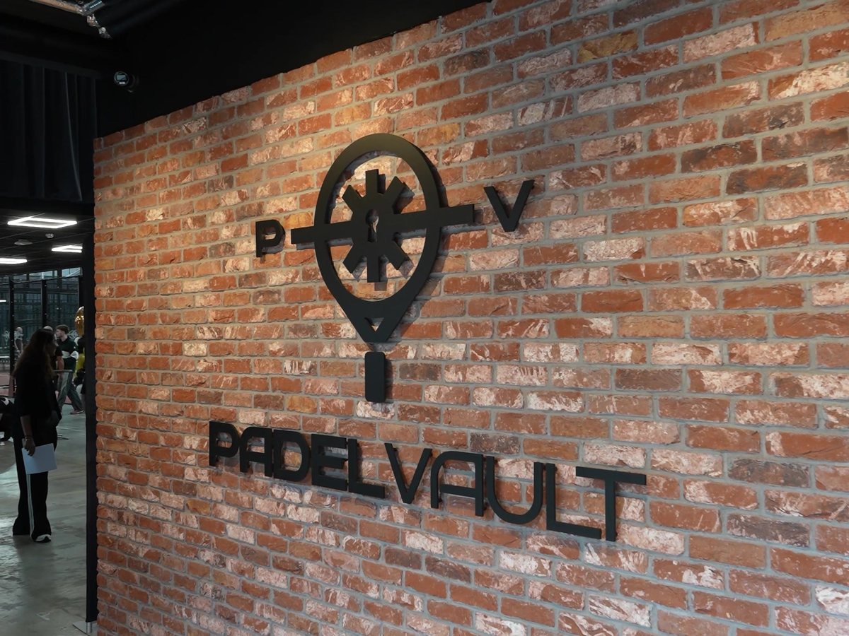 3D Padel Vault logo and lettering on the reception brick wall