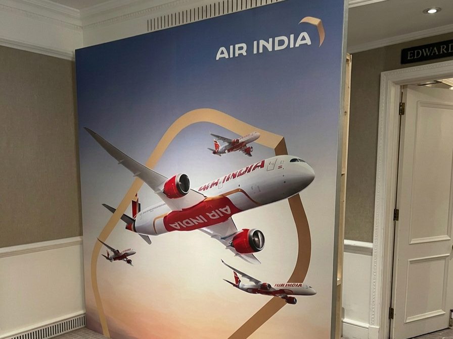 Air India printed backdrop wall with aircraft artwork in a London hotel event space