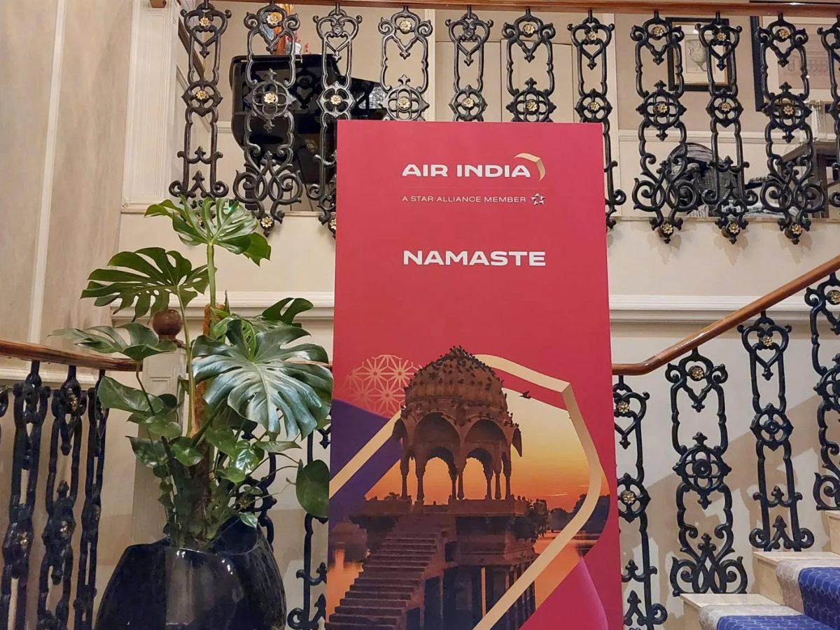 Air India Namaste welcome board at the foot of a hotel staircase