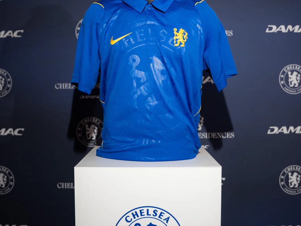 Chelsea FC shirt displayed on a branded plinth