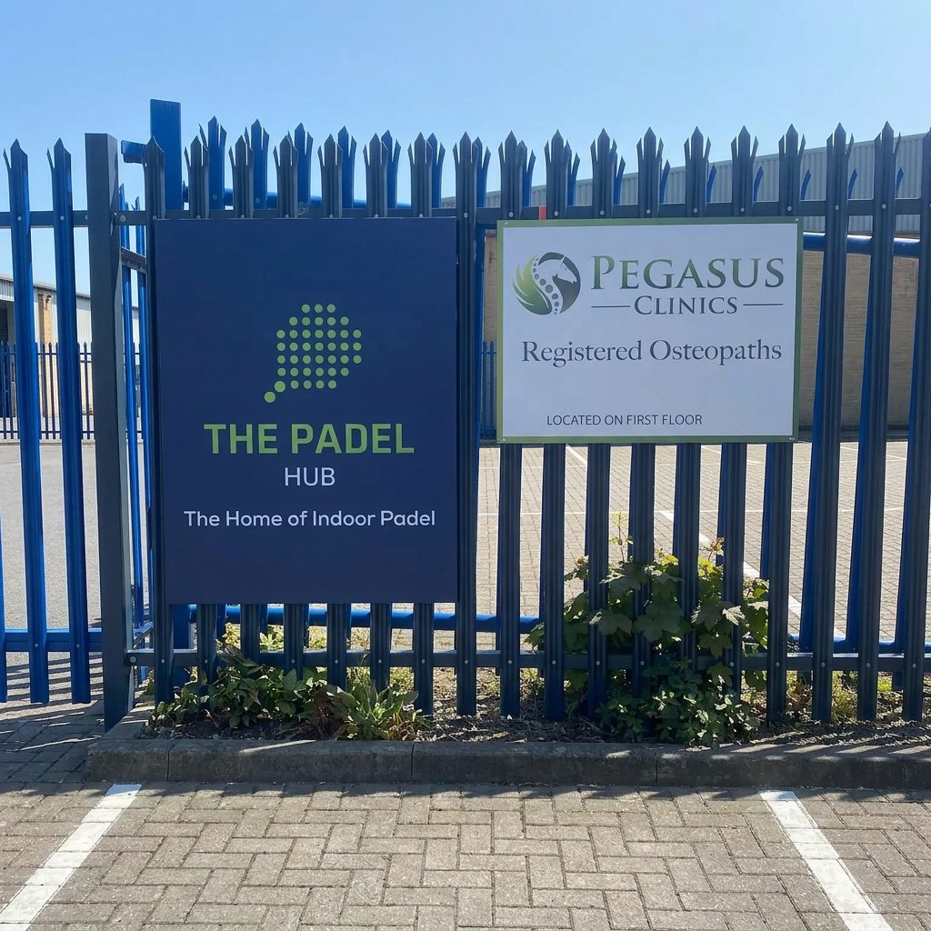 Weatherproof Pegasus and Padel Hub panel signs on the palisade fencing