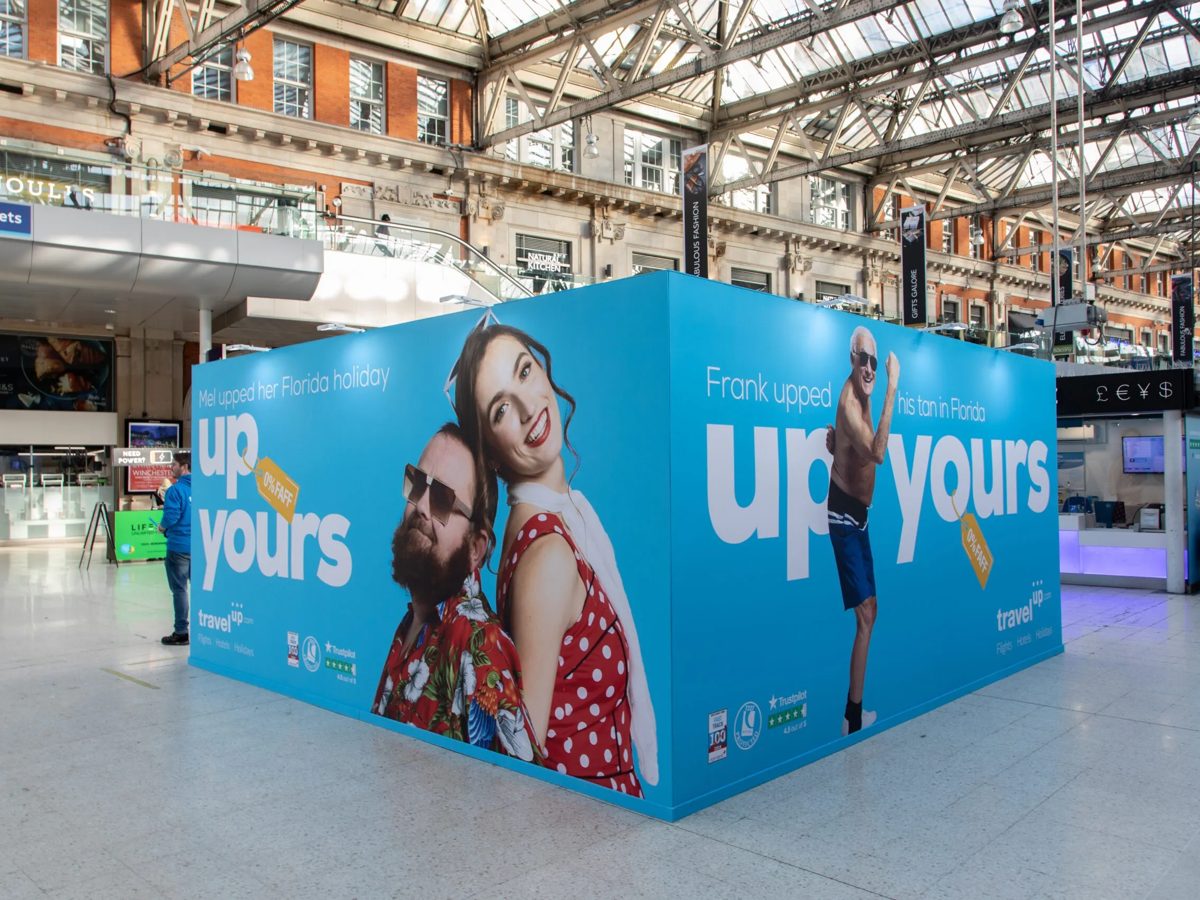 Corner of the Travelup campaign walls under the Waterloo station roof