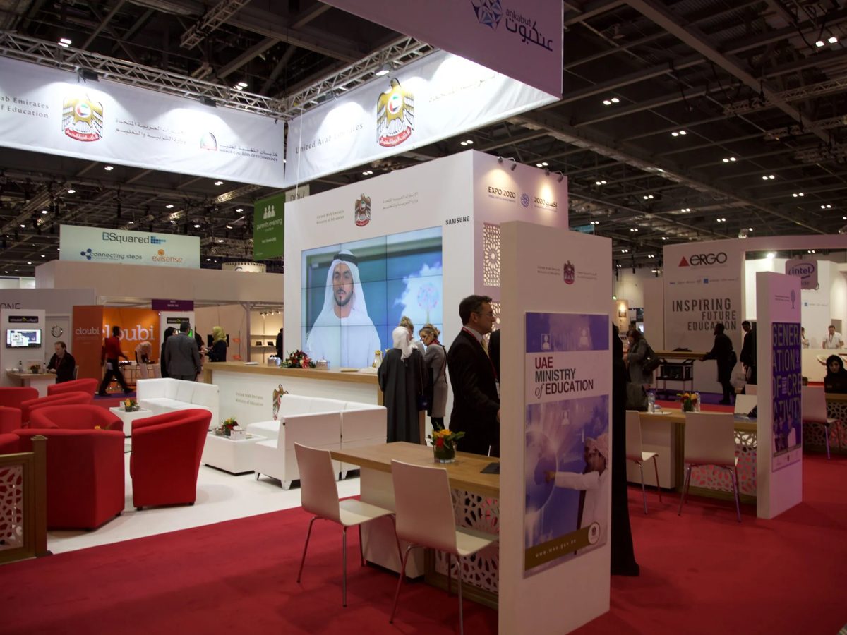 Visitors on the stand with printed totems and hanging banners