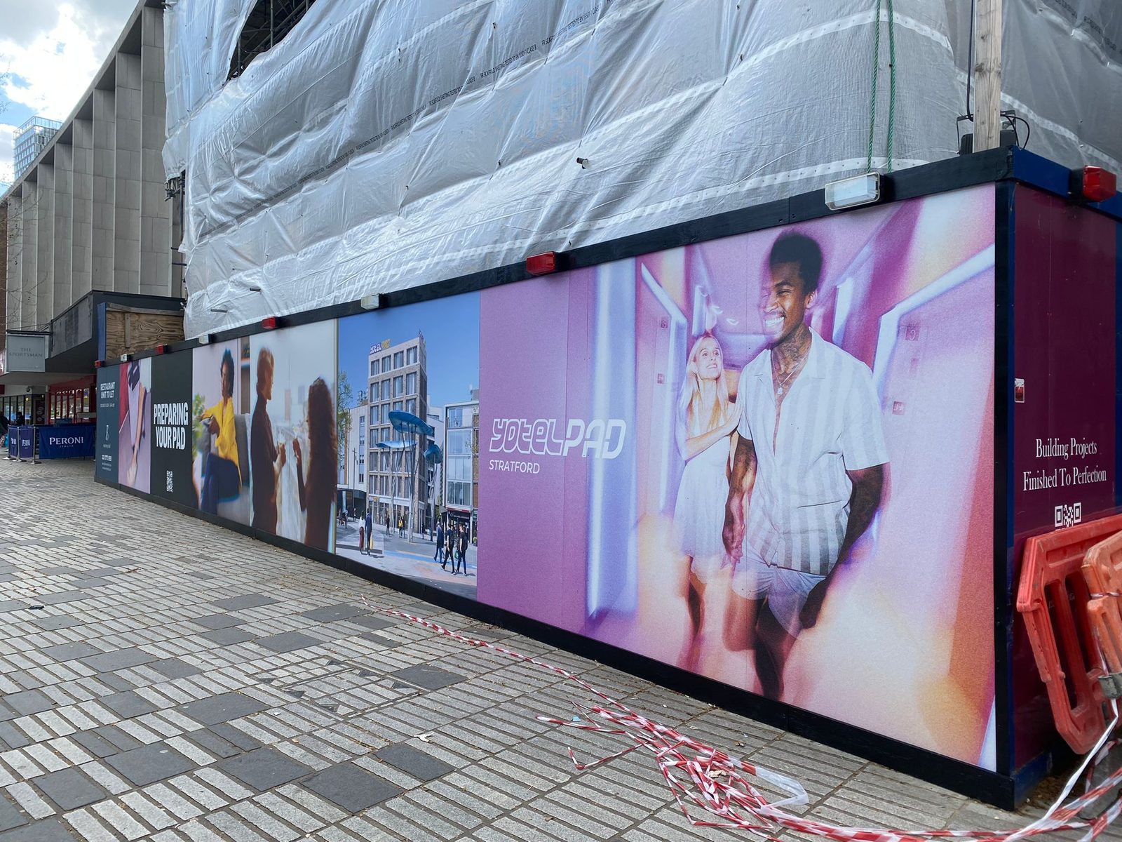 The full run of YOTELPAD Stratford hoarding graphics along the high street