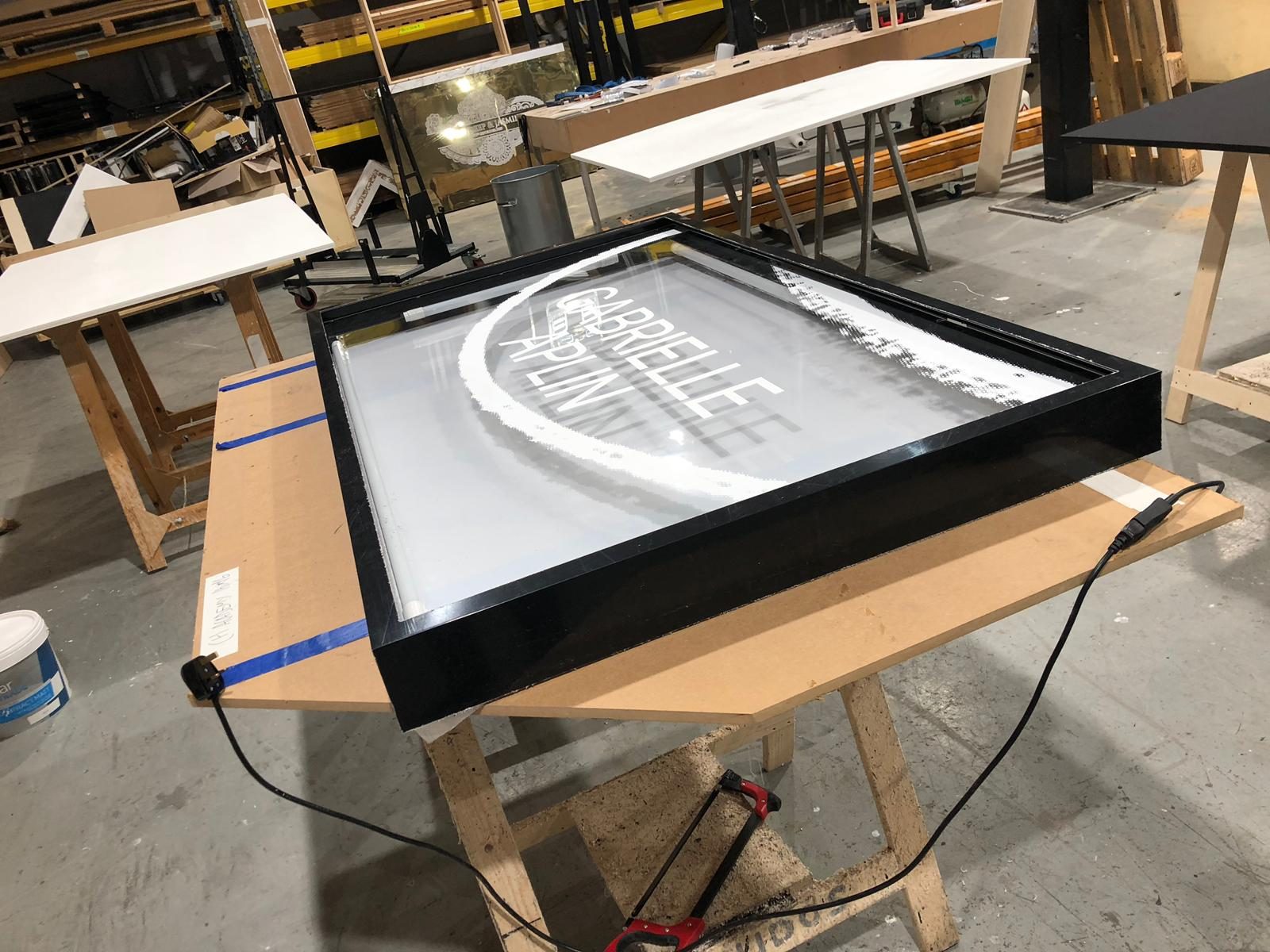 Fitting the printed Gabrielle Aplin acrylic face into its custom frame