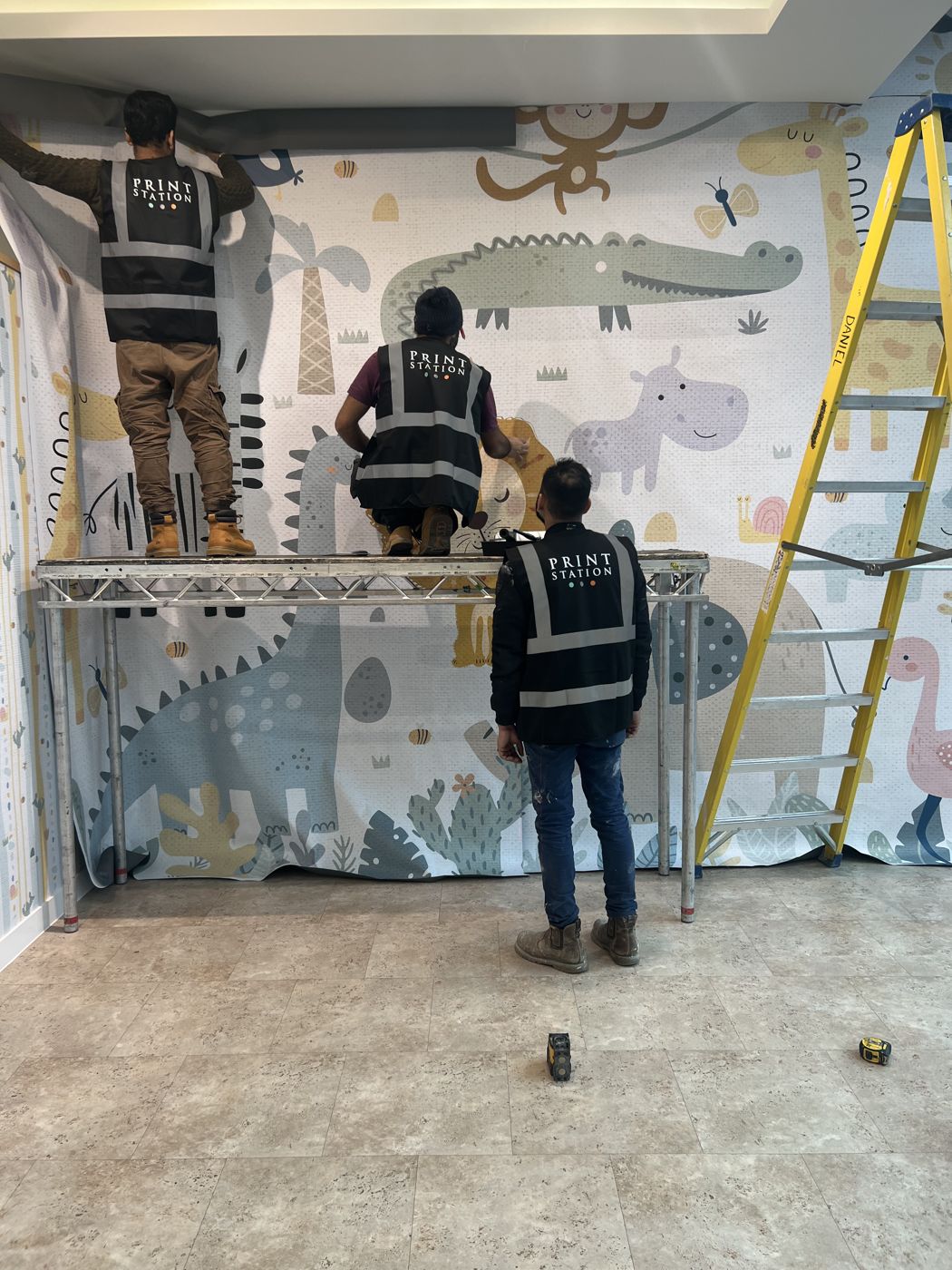 Installing the children's mural wall covering