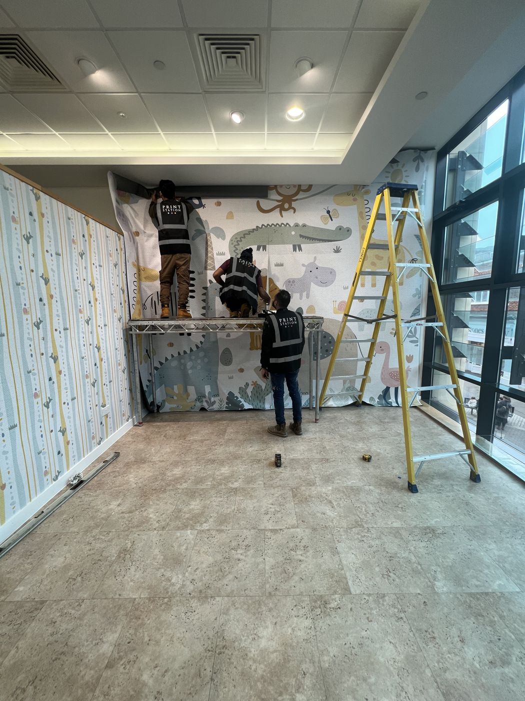 The mural going up alongside the botanical walls