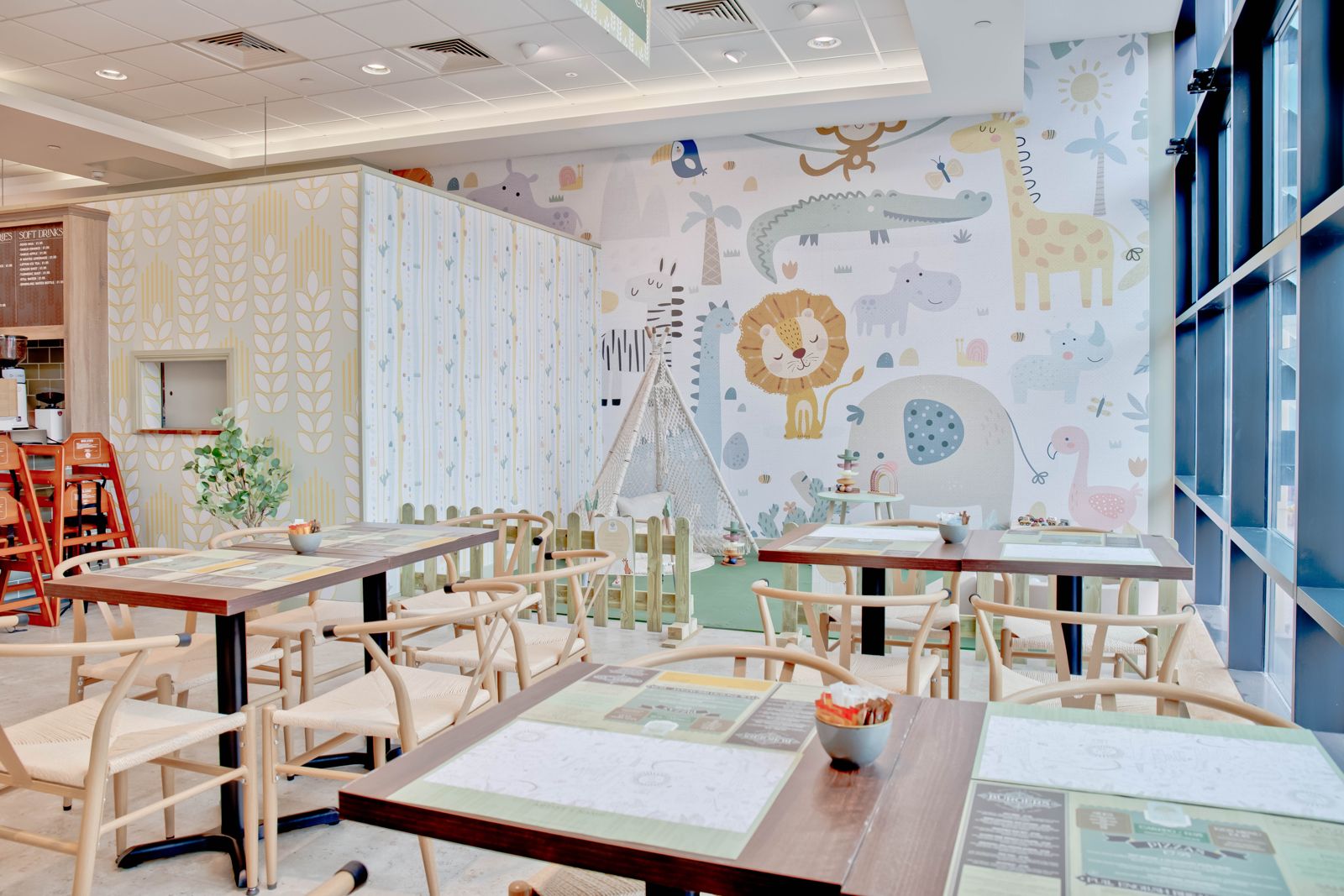 The children’s play area with the jungle mural