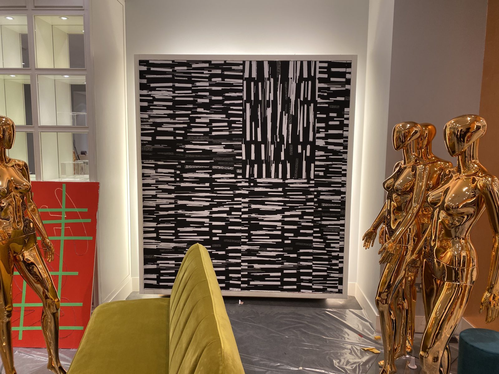 Wrapped cabinets and display shelving across the shop floor