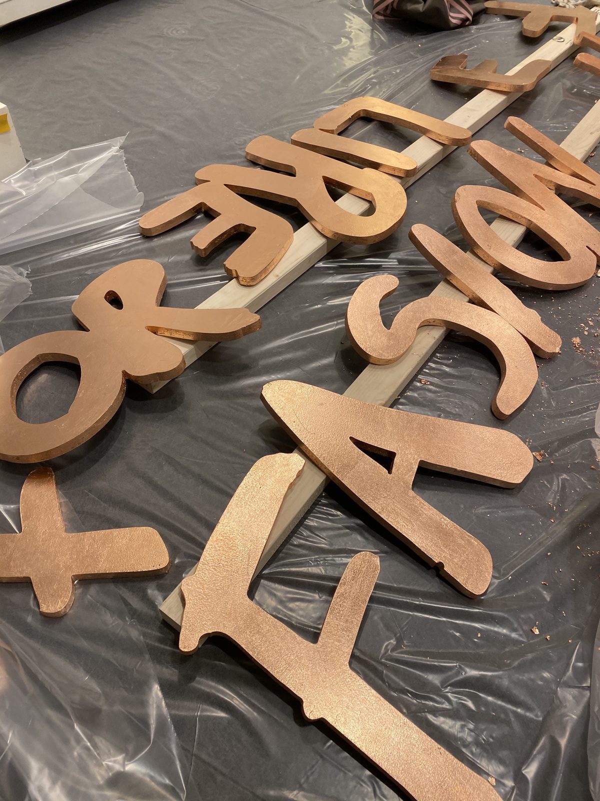 The CNC cut Fashion for Relief lettering, laid out before fixing