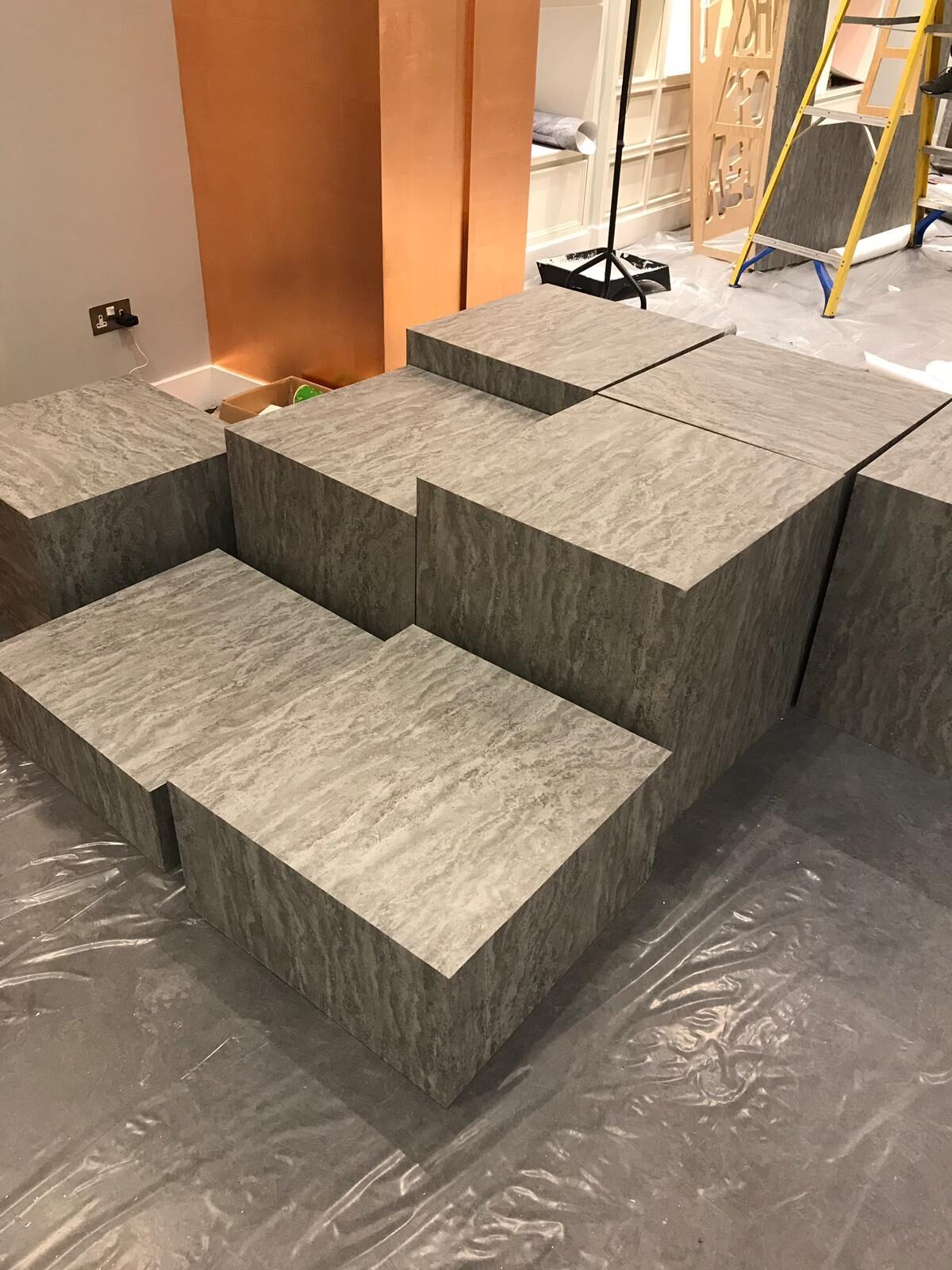 Display plinths made by our team and wrapped in grey furniture vinyl