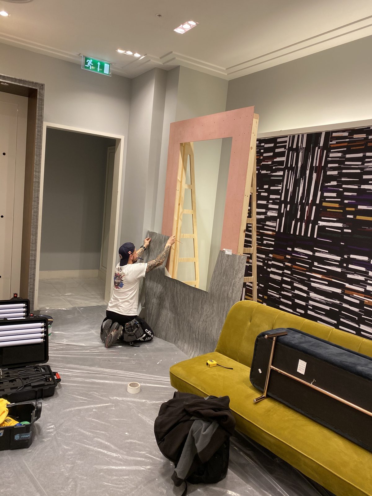 Our installer wrapping a cabinet frame by hand