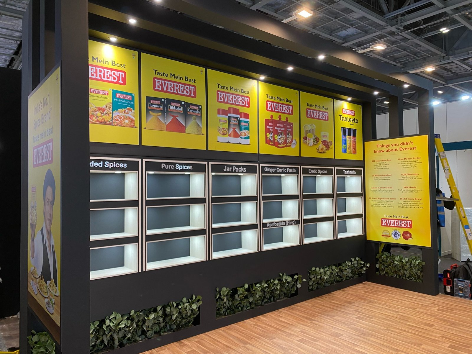 Everest Spices exhibition stand with a printed, lit product wall