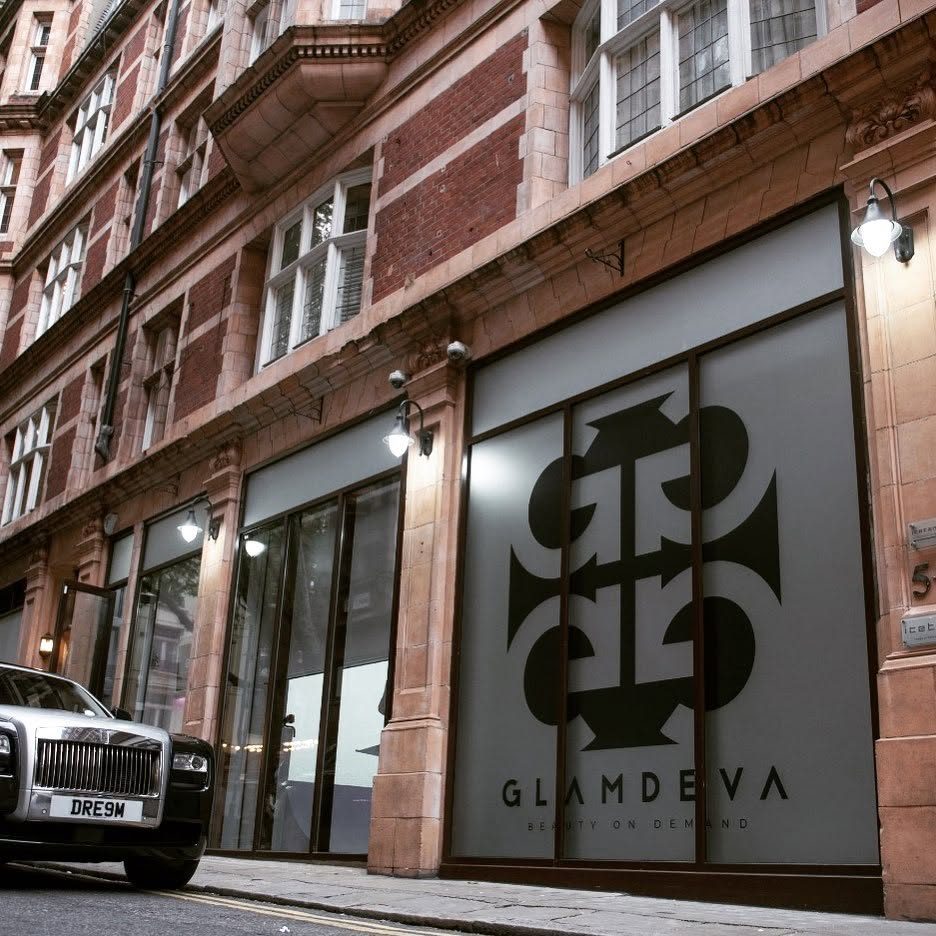 Glamdeva pop up shopfront in London with full height frosted window vinyl and a large black Glamdeva monogram and Beauty on Demand lettering