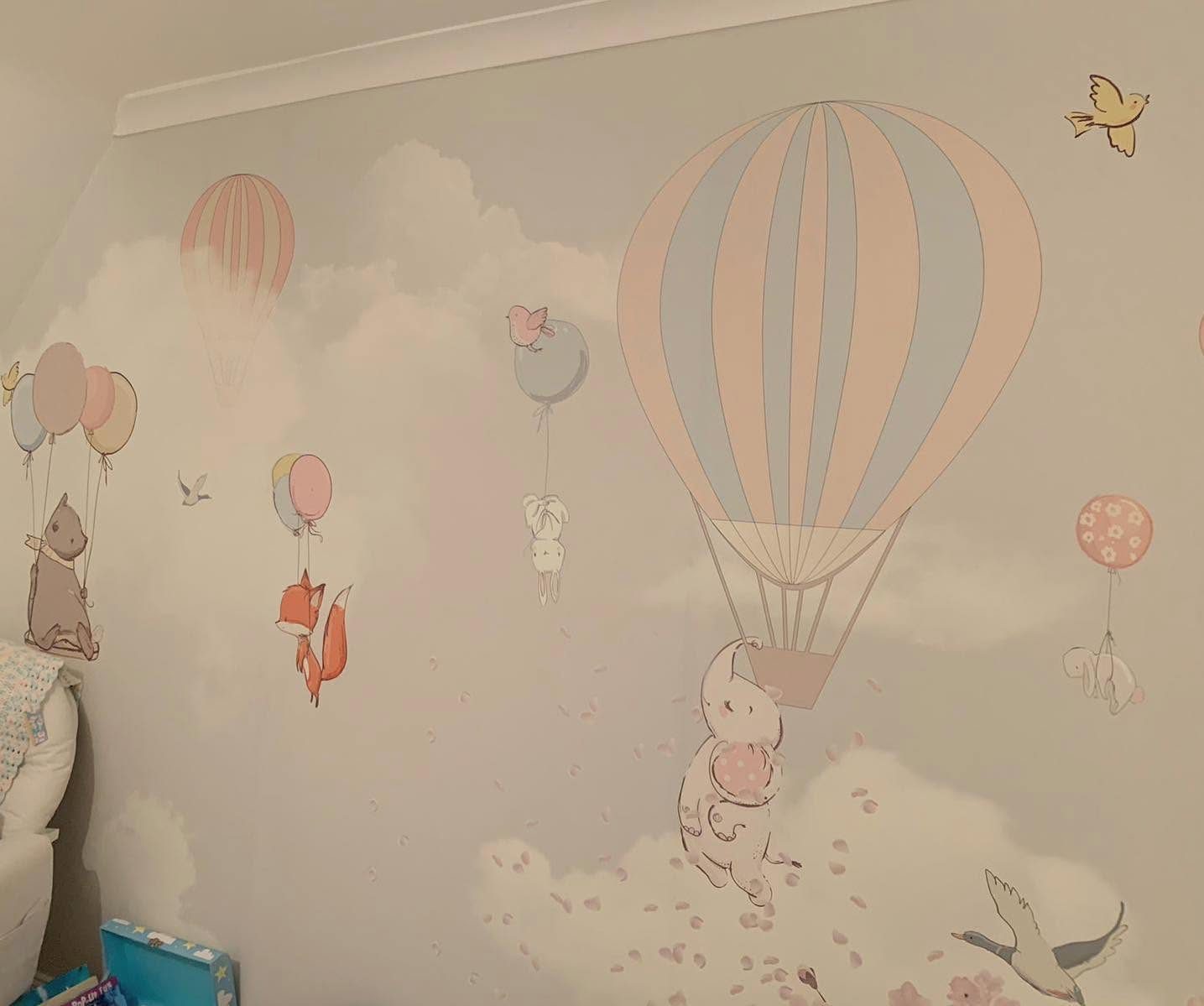 Custom printed kids bedroom wallpaper with pastel hot air balloons, fluffy clouds and woodland animals floating on balloons