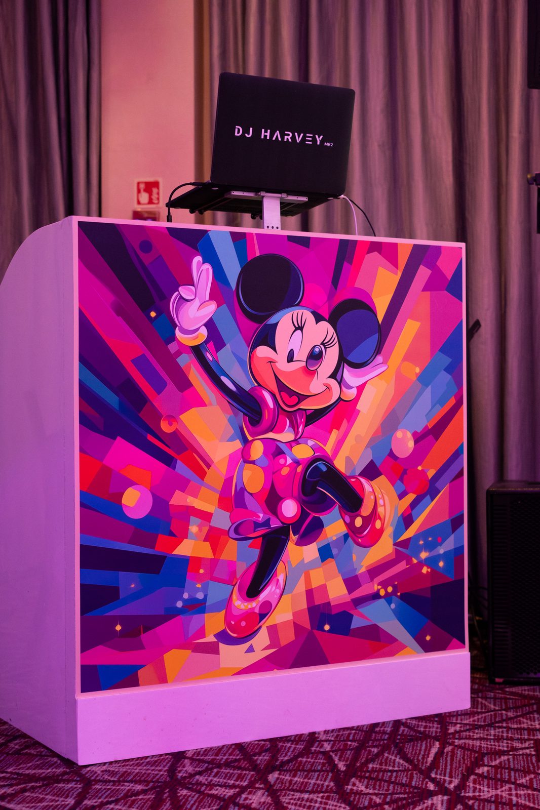 Printed DJ booth with a bold pop art Minnie Mouse design for a kids birthday party