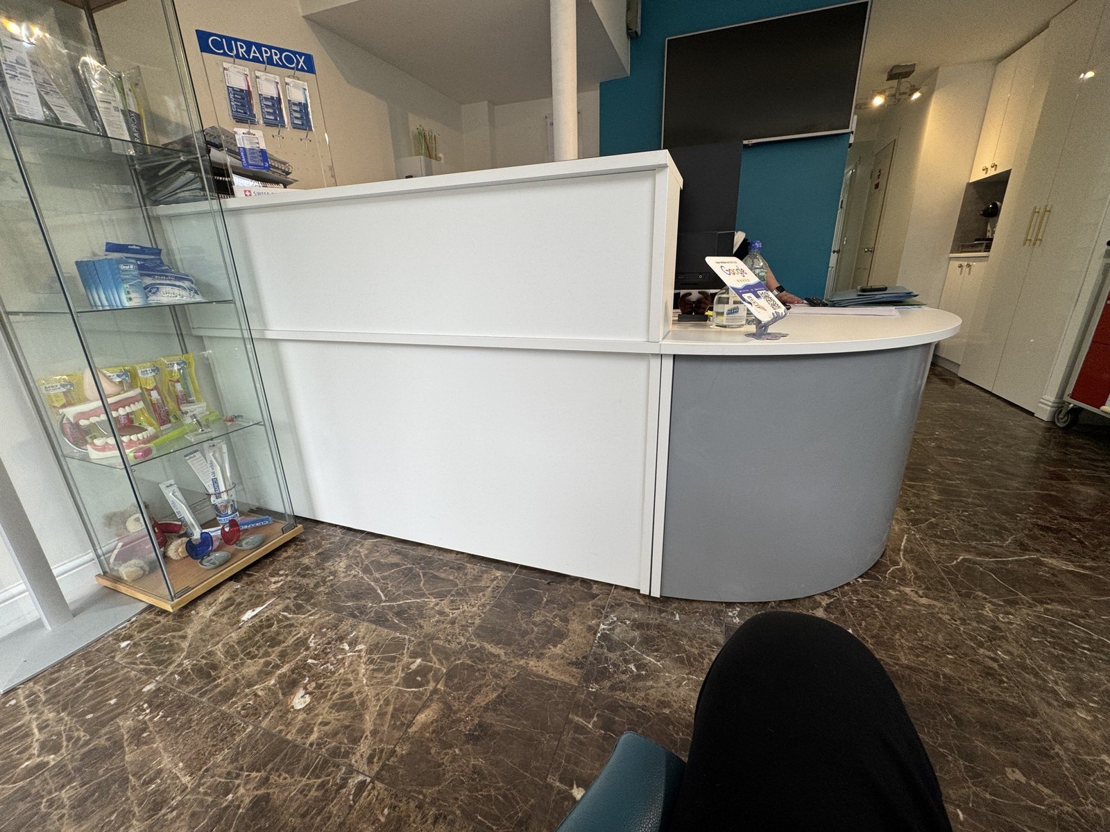 Before: the old reception desk taking up much of the waiting area