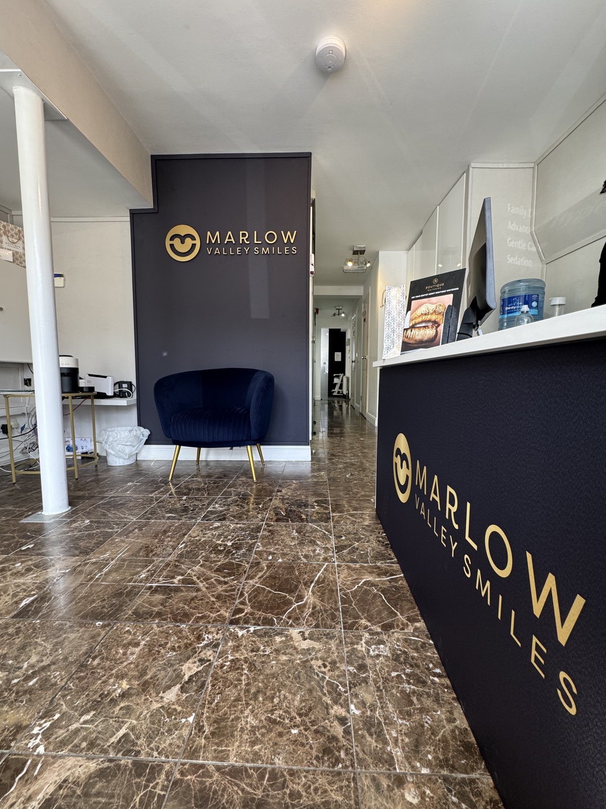 The new reception desk clad in printed ACM