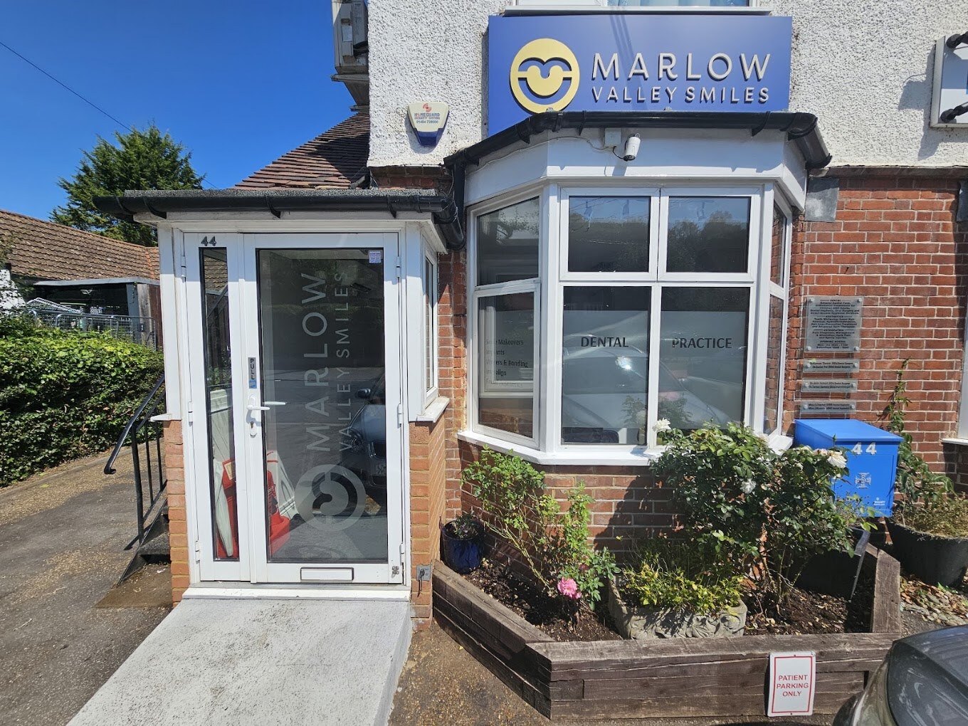 The new tray sign outside, with frosted vinyl on the door and bay window