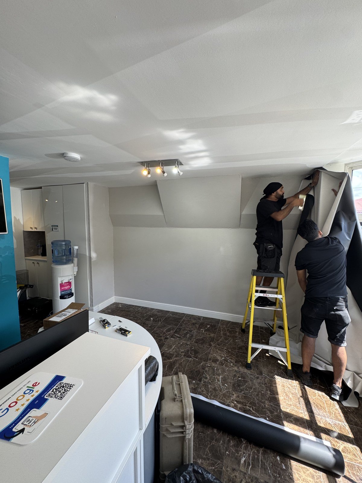 Our team fitting the one piece wall vinyls