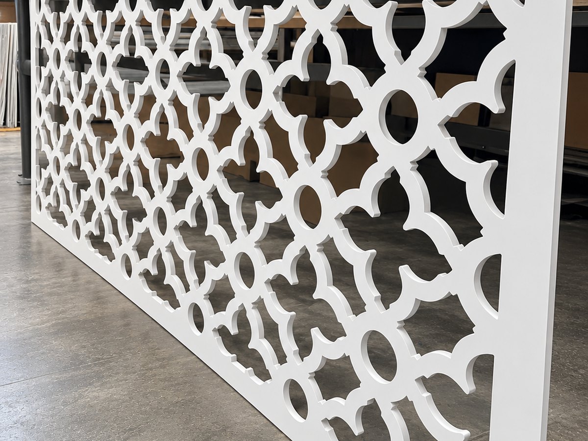 White Foamex screen panel CNC cut with a geometric lattice pattern in our workshop