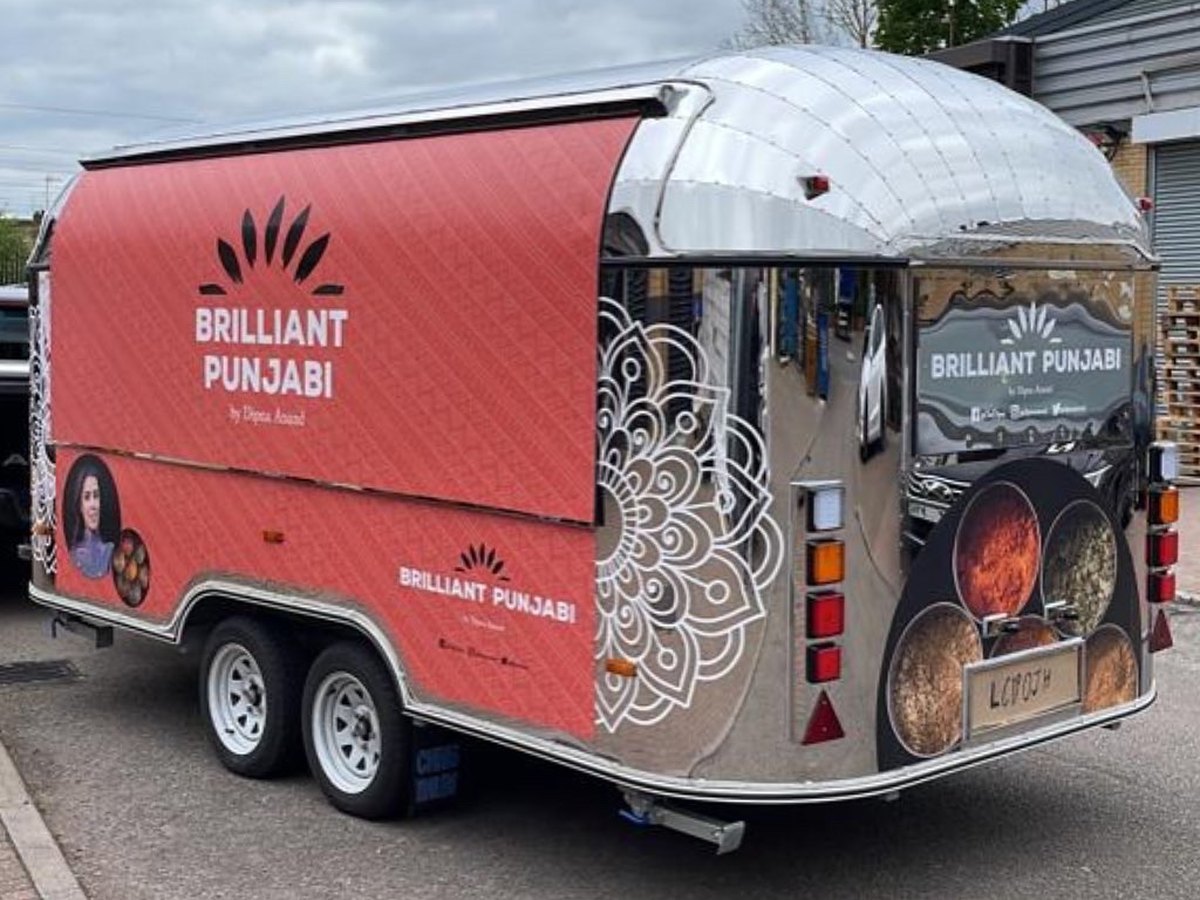Rear view of the Brilliant Punjabi trailer with its printed vinyl wrap