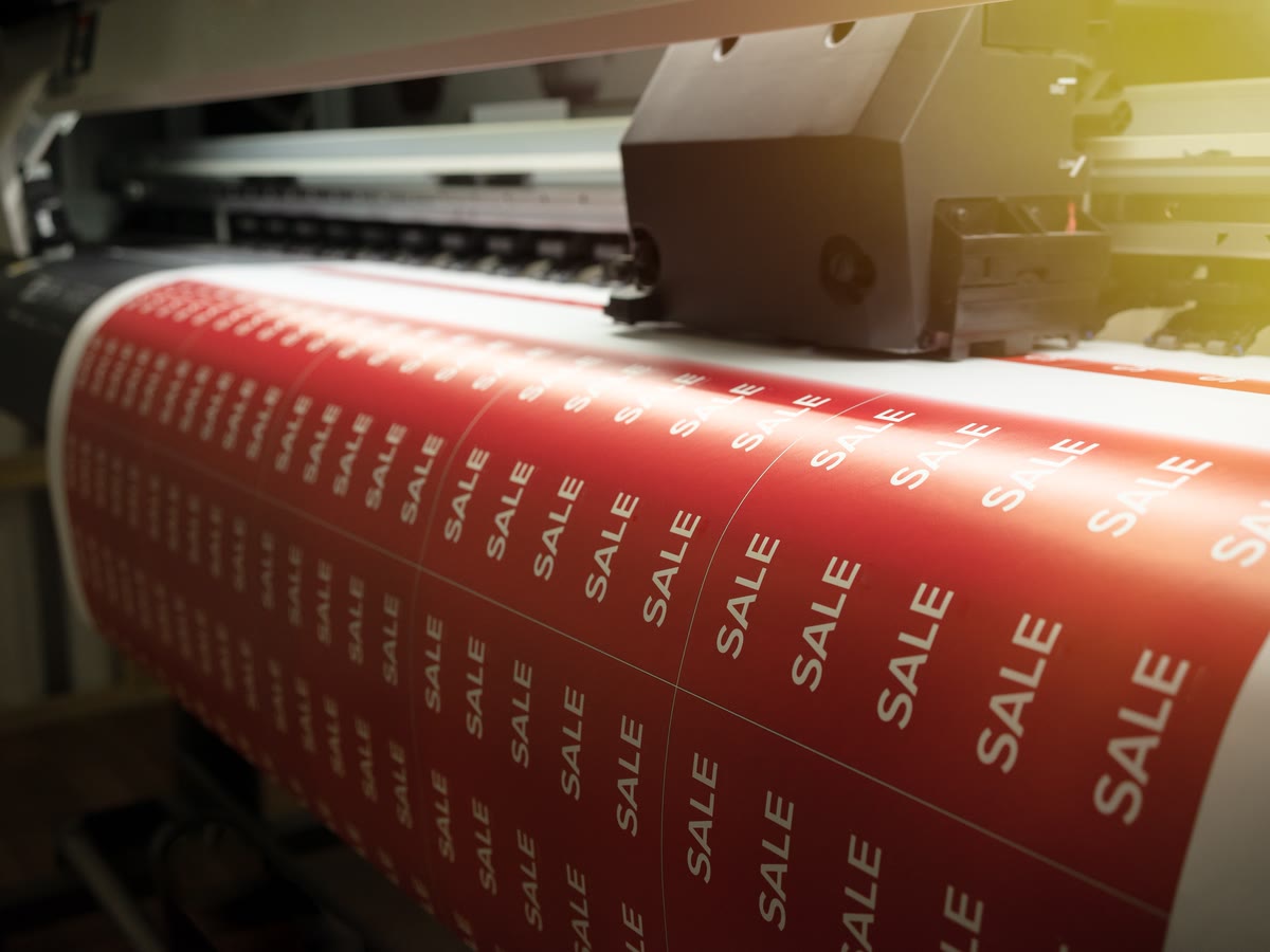 Red SALE vinyl stickers printing on a wide format roll printer